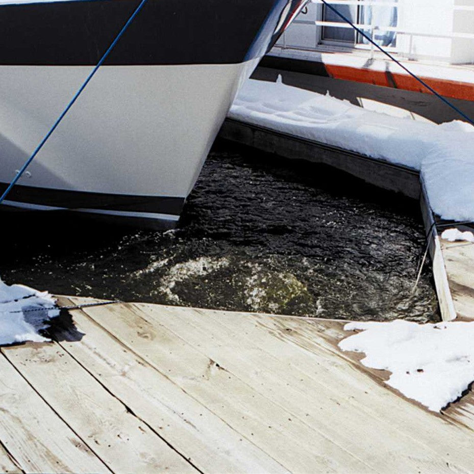 Open water maintained around a boat bow by a Kasco de-icer